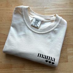 Original Mama of three design on Comfort Colors Heavyweight T-shirt [C1717] made with sustainably and fairly sourced USA Cotton in the color Ivory! personalization available! number of hearts for each child (up to 3 available at this time) Each item is MADE TO ORDER! :) Processing time is currently 7-10 days. Because this is a made to order product, returns are not accepted. However, should you have any issues with your order, please reach out to us.  CARE INSTRUCTIONS:  Turn garment inside out. Machine Wash Cold on Delicate or Hand Wash Cycle. You may tumble dry on lowest heat setting, though this isn't ideal. Lay flat or line dry to extend the lifetime of your item. Family Matching Cotton T-shirt Gift, Relaxed Fit Cotton T-shirt As Gift, Cute Organic Cotton T-shirt For Everyday, Long Sleeve T-shirt For Mother's Day, Custom Print Cotton T-shirt For Family, Relaxed Fit Organic Cotton Tops With Custom Print, Organic Cotton Top With Custom Print In Relaxed Fit, Organic Cotton Crew Neck Top With Custom Print, Everyday Organic Cotton Tops With Screen Print