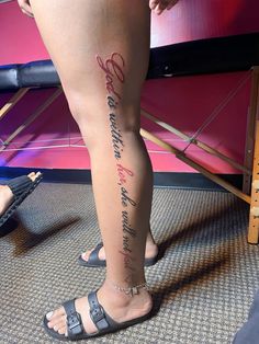 a woman's leg with writing on it