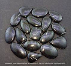 some very pretty black stones on a table