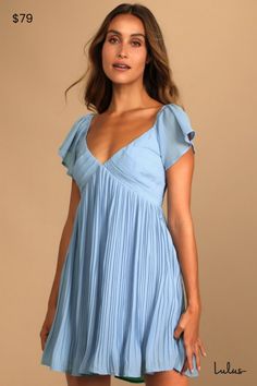 Set off to far-off destinations in style with the Lulus Amalfi Coast Light Blue Pleated Flutter Sleeve Mini Dress! Lightweight woven fabric shapes this pleated dress that has a V-neckline and fluttery short sleeves with elastic that can be worn on or off-the-shoulder. Contrasting pleats accent the bodice atop an empire waist and flowy mini skirt. Tying accent at the back. Hidden side zipper/clasp. Fit: This garment fits true to size. Length: Mid-thigh. Size medium measures 32" from shoulder to hem. Bust: Works best for A to C cup sizes. Waist: Loosely Fitted. Hip: Loosely Fitted. Undergarments: May be worn with petals, or no bra. Fabric: Fabric has no stretch. Fully lined. Shell: 100% Polyester. Lining: 95% Polyester, 5% Spandex. Hand Wash Cold. Do Not Bleach. Line Dry. Iron Low Heat. Impo Flowy Mini Skirt, Blue Sundress, Light Blue Dresses, Pleated Mini Dress, Blue Mini Dress, Cute Summer Dresses, Lulu Dresses, Amalfi Coast, Mini Dress With Sleeves