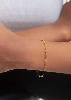 "This beautiful dainty mini paperclip chain bracelet will be a perfect everyday piece. Made entirely of solid 10k yellow gold and finished with a lobster clasp.  chain links are 5mm long and 2mm wide.  Options: 1) You can also add a tiny bezel set gemstone charm: -4mm round amethyst, 3x6mm marquise amethyst, 5x7mm garnet or 4x6 pear peridot. All these stones are also set in solid gold.  2) bracelet can be made 6\", 7\" or 8\" long." Chain Links, Trombone, 10k Gold, Chain Link Bracelet, Paper Clip, Arm Band, Chain Bracelet, Lobster Clasp, Garnet