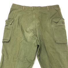 Vintage US Army Pants 1940s-1960s Size: large  Measurements:  waist- 39” length- 46” top to crotch- 16” Military Style High-waist Bottoms With Belt Loops, Military Style Full Length Bottoms With Belt Loops, Retro Full-length Cargo Pants With Pockets, Vintage Wide-leg Cargo Pants, Retro Full-length Bottoms With Cargo Pockets, Retro Full Length Cargo Pants With Pockets, Retro High Waist Cargo Pants, Vintage Cargo Pants With Tapered Leg, Vintage Tapered Leg Cargo Pants