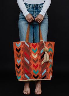 Compliments are guaranteed with this tote bag design! Our orange with teal, brown, lilac, cream and black Aztec inspired tote is perfect for your spring break travels this season. Orange Tote Bag For Daily Use, Large Capacity Orange Canvas Tote Bag, Bohemian Orange Bag For Shopping, Bohemian Orange Shopping Bag, Orange Canvas Tote Bag For Daily Use, Orange Tote Bag For Everyday, Orange Bags For Market, Multicolor Canvas Tote Bag With Leather Handles, Orange Tote Bucket Bag For Everyday Use