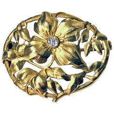 Art Nouveau 18K Diamond Brooch, C.1900. The brooch of oval pierced foliate design, the main floral petal set in the centre with a small old cut diamond. Trombone clasp to reverse. Measures: 3.00 x 2.00 cm. Item Weight: 4.30 grams. Acid tested 18K. Georgian Jewelry, Edwardian Jewelry, Art Nouveau Jewelry, Diamond Brooch, Pot Of Gold, Antique Buttons, Trombone, Classic Art, Antique Jewelry