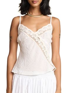 This classic cami effortlessly combines comfort and style, providing a soft and breathable fit for all-day wear. A fun summer twist on our classic Rio Camisole with sheer cotton gauze cups. 100% rayon body, 100% cotton lace and chest Made in Los Angeles Save Energy: cold water wash and air dry (or tumble dry low) Rishika is 5'9 and wears a X-Small Chic Cotton Camisole With Built-in Bra, Feminine Camisole With Built-in Bra For Vacation, Cotton Tops With Built-in Bra For Daywear, Chic Summer Lace Top With Built-in Bra, Feminine V-neck Top With Adjustable Straps, Spring Lace Cami Top With Built-in Bra, Spring Cotton Lace Top With V-neck, Feminine Lace Top With Built-in Bra For Summer, Cotton Camisole With Built-in Bra For Vacation