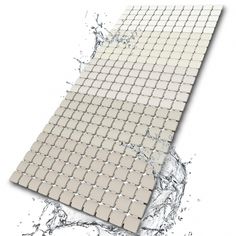 a white tiled wall with water splashing around it and the bottom half is shown