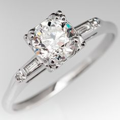 a diamond ring with two baguets on the side