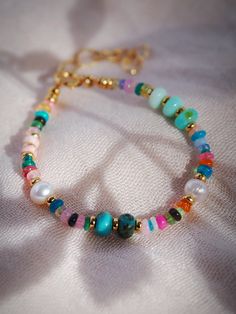 "This modern mixed rainbow gemstone and pearl bracelet is a must have. The elegant mix of pearls and gemstones including opals, turquoise, quartz and more make this beaded bracelet versatile and an instantaneous favorite. ✦ DETAILS ✦ ✧ Name: Kainui (kaee NOO ee) - big sea, great sea. ✧ Mixed Gemstones and Freshwater Pearls. ✧ Adjustable fit 6\"-8\" inches. ✧ 14kt Gold Filled components and clasp. ✧ All Ke Aloha Jewelry pieces come packaged thoughtfully, beautifully, and ready for gift giving. ✧ Delicate Gold Bracelet, Big Sea, Silver Diamond Bracelet, Hawaii Jewelry, Dainty Gold Bracelet, Rainbow Gemstones, Circle Bracelet, Homemade Jewelry, Gold Chain Jewelry