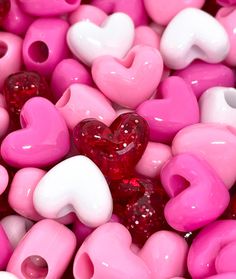 pink and white heart shaped beads are shown