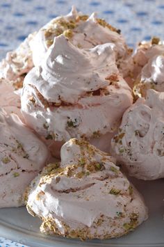 a white plate topped with cookies covered in frosting