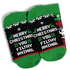 Step up your holiday sock game with these funny Christmas sweater style socks! These festive socks boast a classic Nordic sweater-style knit pattern featuring Christmas trees, presents, and a cheeky surprise if you look closely! On the bottoms, you'll find a saying that'll light up any Christmas movie buff: "Merry Christmas You Filthy Animal"! Looking for a fun stocking stuffer? These socks are the perfect gift for anyone with a great sense of humor. They'll love sporting them all season long - Funny Christmas Sweater, Ugly Sweater Contest, Animal Socks, Cute Christmas Outfits, Nordic Sweater, Holiday Socks, Style Socks, Funny Christmas Sweaters, Best Stocking Stuffers