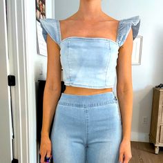 Light Blue Acid Washed Denim Crop Top. Stretchy Ruffle Sleeves, Zip Up The Back. Size Small, Never Worn. This Is So Cute, Sadly It’s Just Too Big For Me Chic Fitted Denim Top With Ruffles, Non-stretch Denim Blue Trendy Tops, Chic Denim Top With Ruffles For Spring, Casual Cropped Denim Top With Stretch, Casual Stretch Cropped Denim Top, Chic Ruffled Denim Top For Summer, Trendy Ruffled Denim Top For Spring, Casual Cropped Denim Top, Fitted Medium Wash Denim Top With Ruffles