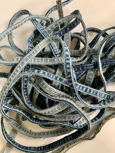 a pile of blue and white ribbon sitting on top of a table