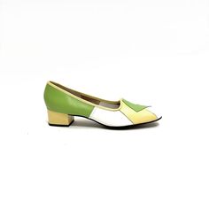 Vintage 1970s deadstock colorblock pieced leather slip on heels by Naturalizer. Features spring green, pastel yellow and white pieces leather uppers. With rounded toe, slip on style, and yellow leather block heel. With original shoebox and sales receipt. Excellent like new vintage condition.   Heel to toe (inside shoe): 10.625 inches  Ball of foot (bottom of sole): 3.125 inches  Heel height: 1.625 inches  Size 10 Retro Green Closed Toe Heels, Green Retro Closed Toe Heels, Green Closed Toe Retro Heels, Retro Green Round Toe Heels, Retro Green Heels With Round Toe, Retro Green Leather Heels, Green Retro Heels With Round Toe, Green Leather Retro Heels, Green Low Heel Retro Heels