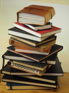 a stack of books sitting on top of each other