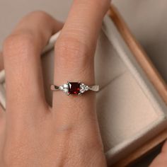 Fine Jewelry Princess Cut Solitaire Birthstone Ring, Elegant Garnet Solitaire Birthstone Ring, Garnet Emerald Cut Promise Ring, Promise Princess Cut Birthstone Ring With Cubic Zirconia, Emerald Cut Garnet Promise Ring, Emerald Cut Garnet Birthstone Jewelry, Classic Princess Cut Ruby Ring As Gift, Classic Princess Cut Ruby Ring Gift, Promise Princess Cut Birthstone Ring