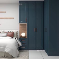 a bedroom with blue cabinets and a white bed