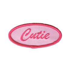 a pink patch with the word cutie on it