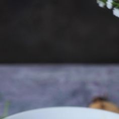 a white bowl filled with food on top of a table