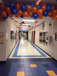 the hallway is decorated with balloons and streamers