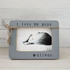 a baby's photo frame with the words i love my pops in black and white