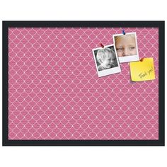 a pink and white photo frame with two photos on the wall next to a post it note