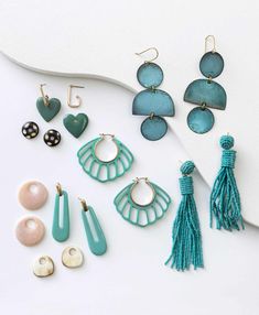 This sea-inspired statement made of hand carved horn is sure to give you that beach-chic look. Chic Summer Jewelry For Gifts, Trendy Single Earring For Beach Jewelry, Trendy Single Earring For Beach, Single Drop Earring For Vacation, Trendy Turquoise Jewelry For Vacation, Trendy Shell-shaped Jewelry Gift, Trendy Beach Drop Earrings, Chic Dangle Jewelry For Beach, Chic Dangle Jewelry For The Beach