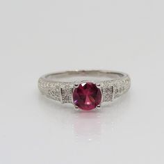 Vintage Sterling Silver White Topaz & Ruby Ring ...Marked 925...Total of weights 3.1grams...Size 6...Measure of stone center 6MM...It's in very good condition. A Classic Round Gemstones With Center Stone, Classic Round Cut Gemstones With Accent Stones, Cubic Zirconia Gemstones With Center Stone, 14k White Gold Ruby Ring With Center Stone, White Gold Ruby Ring With Center Stone, 14k White Gold Round Ruby Ring With Center Stone, Anniversary Gemstones With Brilliant Round Cut, Round Cut Center Stone Gemstones For Anniversary, Ruby Ring With Accent Stones