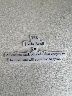 a sign on the wall that says, tbr to be read an endless stack of books that are yet to be read and will continue to grow