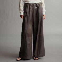 Mid-rise, wide leg pant with an elastic waistband Paperweight leather: 100% leather Inseam: 33" Rise: 11.5" We suggest getting your normal size. L421765L-L022 Paper Leather, Velvet Coat, Clothing Pants, Leather Trousers, Wide Leg Pant, Everyday Dresses, Wide Leg Denim, Cropped Denim, Bottom Clothes