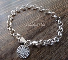 It is made with link 6.6mm rolo chain sterling silver lotus flower charm of 13 mm. and lobster clasp 13mm. This bracelet looks gorgeous on your wrist. A classic that never outdated. Handmade. All componenetes of this bracelet are sterling silver Not plated No extra charge for extra items. One flat fee for your entire purchase It is sent in a nice gift box by registered mail with tracking number. Thanks for visiting Caneladeplata. Silver Charm Bracelet With Rolo Chain For Gift, Sterling Silver Charm Bracelet With Rolo Chain, Sterling Silver Charm Bracelet With Rolo Chain For Gift, Sterling Silver Rolo Chain Charm Bracelet Gift, Round Rolo Chain Charm Bracelet As Gift, Sterling Silver Bracelets With Rolo Chain, Sterling Silver Bracelet With Rolo Chain, Handmade Sterling Silver Charm Bracelet, Chain Charm Bracelet