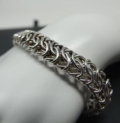 Big and bold. 14mm's wide. Large over sized spring ring closure. Maker's mark is an "E" in a double circle, marked 925 and Italy. 17.17 dwt. polished up and looks as new Chainmail Patterns, Chain Ideas, Chainmail Jewelry, Mesh Bracelet, Maker's Mark, Chain Link Bracelet, Spring Rings, Makers Mark, Arm Band