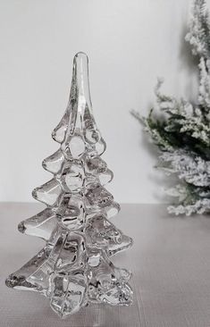 This Glass Christmas Tree is a gorgeous and exquisite decorative item that can brighten up the space. The Glass Christmas Tree features a clear color and a round shape, giving it a simple and refined look. Its smooth and shiny surface reflects light beautifully, creating a dazzling effect. The Glass Christmas Tree is a classic and elegant piece that can add a touch of beauty and grace to any space, from the dining room to the bathroom. It can complement any decor style, from traditional to moder Glass Trees Christmas, Glass Christmas Trees, Glass Trees, Apothecary Candles, Trees Christmas, Love Garden, Beauty And Grace, Glass Christmas Tree, Candle Diffuser