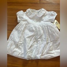 Adorable White Baby Dress With Floral Accents. New With Tags Although Tag Says Two Pieces And This Is Just The Dress, I Think It Had Bloomers That Are Not Included. White Long Sleeve Ralph Lauren Dress, Ralph Lauren Long Sleeve White Dress, Ralph Lauren White Long Sleeve Dress, Cotton Short Sleeve Dress For Baptism, Ralph Lauren Cotton Dresses With Short Sleeves, Ralph Lauren Cotton Short Sleeve Dresses, Ralph Lauren Short Sleeve Cotton Dresses, White Short Sleeve Ralph Lauren Dress, Ralph Lauren White Short Sleeve Dress