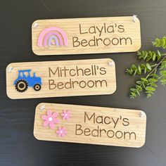 three personalized wooden name tags on a table