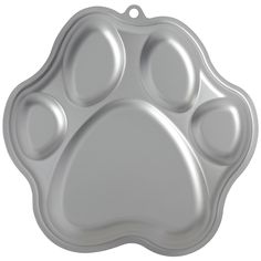 a metal tray with a paw print on it