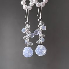 About this itemElevate your jewelry-making game with these exquisite watercolor grape earrings. With their vibrant hues and intricate facets, these beads will add a touch of elegance and sophistication to your outfit. 🍇Material: handmade with the delicate watercolor Czech glass grapes, glass flowers, glass leaves, and the 14K gold plated ear hooks(hypoallergenic). 🌺Size: The bow tie style is about 0.8cm x 2cm. The hook style is about 0.8cm x 3cm. 🎀Handmade: Each item is made to order, which g Winter Inspired Jewelry, Elegant Glass Beaded Drop Earrings, Elegant Faceted Beaded Drop Earrings, White Dangle Earrings With Faceted Details, White Faceted Dangle Earrings, Glass Faceted Beads Earrings For Gift, Glass Earrings With Faceted Beads For Gift, Glass Earrings With Faceted Beads As A Gift, Elegant Glass Crystal Drop Earrings