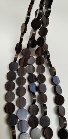 the necklace is made out of wooden discs