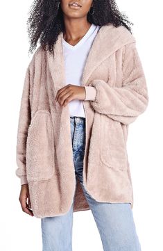 If a comfy robe and cozy blanket got together they'd create this wonderfully plush hooded wrap that's perfect for couch snuggles and coffee-shop hangouts. 32" length (size Small) Fixed hood Long sleeves 100% polyester Machine wash, line dry Imported Cozy Super Soft Outerwear, Cozy Fitted Super Soft Outerwear, Comfy Super Soft Loungewear Outerwear, Cozy Solid Outerwear For Loungewear, Comfy Super Soft Outerwear For Loungewear, Cozy Solid Color Outerwear For Loungewear, Cozy Super Soft Hooded Outerwear, Cozy Snug Outerwear For Loungewear, Snug Cozy Loungewear Outerwear