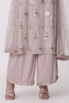 Mauve pink kurta with mirror embroidered buttas. Paired with an embroidered hem pant and dupatta. - Aza Fashions Bollywood Style Pink Kurta With Sequins, Festive Pink Kurta With Sequins, Pink Sequined Kurta For Eid, Festive Pink Sequined Kurta, Festive Pink Sequin Kurta, Designer Pink Sequined Salwar Kameez, Pink Sequined Straight Kurta Set, Pink Sequined Kurta For Festivals, Pink Embellished Kurta For Festivals