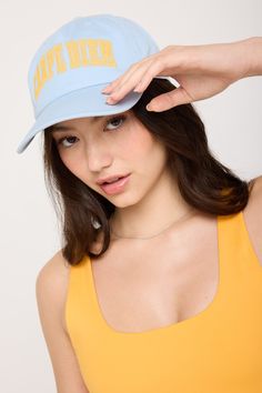 Seize the day. This dad hat is designed with an adjustable fit, structured bill, brushed gold hardware, and embroidered details. Made with 100% cotton. | Carpe Diem Canvas Dad Hat in Windsurfer Beach Visor Hat With Letter Print, Letter Print Visor Hats For The Beach, Beach Snapback Visor Hat With Letter Print, Cotton Trucker Hat For The Beach, Trendy Dad Hat With Curved Bill, Beach Dad Hat With Embroidered Logo, Casual Beach Baseball Cap With Embroidered Logo, Casual Embroidered Baseball Cap For Beach, Trendy Flat Brim Baseball Cap With Letter Print