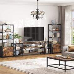 a living room filled with furniture and a flat screen tv on top of a wooden shelf