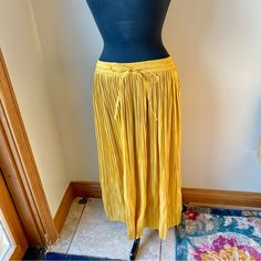 H&M Midi Skirt Satin Pleated Stretch Mustard Yellow Gold Nwt New With Tags. No Flaws Noted. Brand: H&M Midi Skirt Size Small Golden Yellow Color Elasticized Stretch Waistband With Drawstring Ties Silky Satin Texture Pleated Polyester Measurements Are Approximate With Item Laying Flat: Waist: 26” Unstretched, Stretches To 38" Length: 33” From A Smoke Free, Pet Friendly Home. Yellow Wide Leg Maxi Skirt For Spring, Yellow Long Skirt For Fall, Yellow Summer Maxi Skirt With Elastic Waistband, Chic Yellow Skirt With Elastic Waistband, Yellow Skirt For Workwear In Fall, Yellow Pleated Skirt For Work, Yellow Pleated Workwear Skirt, Yellow Stretch Skirt For Fall, Stretch Yellow Skirt For Fall