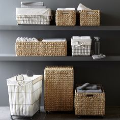 wicker baskets are stacked on the shelves