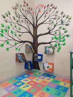 a tree painted on the wall in a children's room with colorful rugs