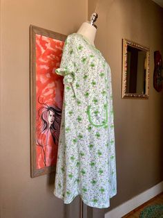 "This listing is for a cute little vintage 80s/90s floral cottagecore nightgown. It's so darling with its little ruffled collar and sleeves! It has pockets to hold your treasures and features a whimsical print of green scattered flowers with little pink birds. It's a very light and airy cotton/poly blend nightgown and buttons down the front. The nightgown is in excellent vintage condition, showing no real signs of wear. There are no notable flaws that I can see. The tag states it is a size mediu Cotton Cottagecore Nightgown For Sleep, Cottagecore Cotton Nightgown For Sleep, Cottagecore Cotton Nightgown For Bedtime, Short Sleeve Floral Print Nightgown For Home, Cotton Cottagecore Dress For Bedtime, Floral Print Short Sleeve Nightgown For Sleepover, Cotton Cottagecore Nightgown, Cotton Cottagecore Sleepwear For Sleepovers, Cottagecore Cotton Sleepwear For Sleepover