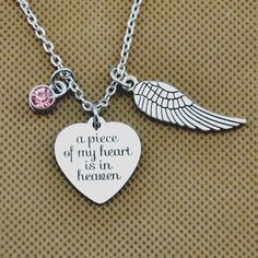 "Color:silver - a engraved \"a piece of my heart is in heaven\" Charm: 3/4\" x 7/8\" -Angel Wing Charm 9x30mm - Antique silver chain with lobster clasp 22\" Birthstone: please choose Jan=Ruby; Feb=Amethyst; Mar=Aqua blue; Apr=Clear; May=Emerald; June=Pink; July=Ruby red; Aug=Peridot; Sep=Sapphire; Oct=Rose; Nov=Topaz; Dec=Peacock blue you will get 1 pcs Necklace All our items are NICKEL FREE and LEAD FREE. If you need more quantity, please do not hesitate to contact me. * * * * *FEEDBACK * * * * In Loving Memory Of Mom, Loving Memory Of Mom, Parent Loss, Memorial Items, Cosmetologist Gifts, Condolence Gift, Remembrance Jewelry, Baby Loss, Angel Wing Necklace