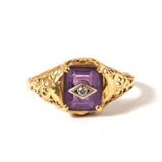 Delicate 14k yellow gold filigree ring set with medium colored amethyst and small round diamond (not tested) in white gold rhombus. Good antique condition with no wear to stone and slight crimping in filigree. Amethyst measures 7mm x 6mm. US size 6. Does not look to have ever been resized. Stamped with makers mark and 14K on inner band. Purple Rose Cut Diamond Rings In 14k Gold, Purple 14k Gold Ring With Rose Cut Diamonds, Purple 14k Gold Rings With Rose Cut Diamonds, Heirloom Gold Amethyst Ring With Diamond, Heirloom Amethyst Ring With Diamond In Gold, Heirloom Purple Diamond Ring, Heirloom Purple Diamond Gemstone Ring, Purple Amethyst Ring With Rose Cut Diamonds, Heirloom Purple Ring With Rose Cut Diamonds