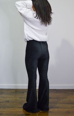 Fitted black high-rise corduroy pant with a bell bottom silhouette. Fits true to size. Stretch Corduroy Flare Bottoms, Stretch Flare Corduroy Bottoms, Black Velvet Bottoms For Night Out, Black Stretch Velvet Pants, Stretch Velvet Flare Bottoms, Flared Velvet Bottoms, Fall Velvet Flare Bottoms, Black Flare Winter Pants, Black Flare Pants For Winter