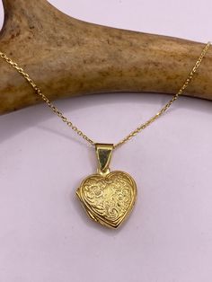 Our Vintage Tiny gold Photo Locket is about 1/2 inch (12mm) long and features a lovely etched design Features a Tiny gold Heart Photo Charm in gold 925 Sterling Silver, perfect for a small photo memory necklace  or other keepsake. (Laminate photo to ensure longevity and long wear) Delicate silver necklace is available in 16, 18, 20, 22, or 24 inches.  Thank you for supporting a Veteran-owned, small business We offer free shipping within the US, and your locket will arrive in a stylish gift box. Gold Etched Heart Jewelry, Gold Round Locket Necklace With Heart Charm, Yellow Gold Etched Locket Necklace As Gift, Etched Heart Gold Jewelry, Dainty Engraved Yellow Gold Locket Necklace, Gold Heart Charm Locket Necklace, Gold Engraved Sterling Silver Locket Necklace, Gold Round Engraved Heart Necklace, Etched Yellow Gold Locket Necklace For Gift